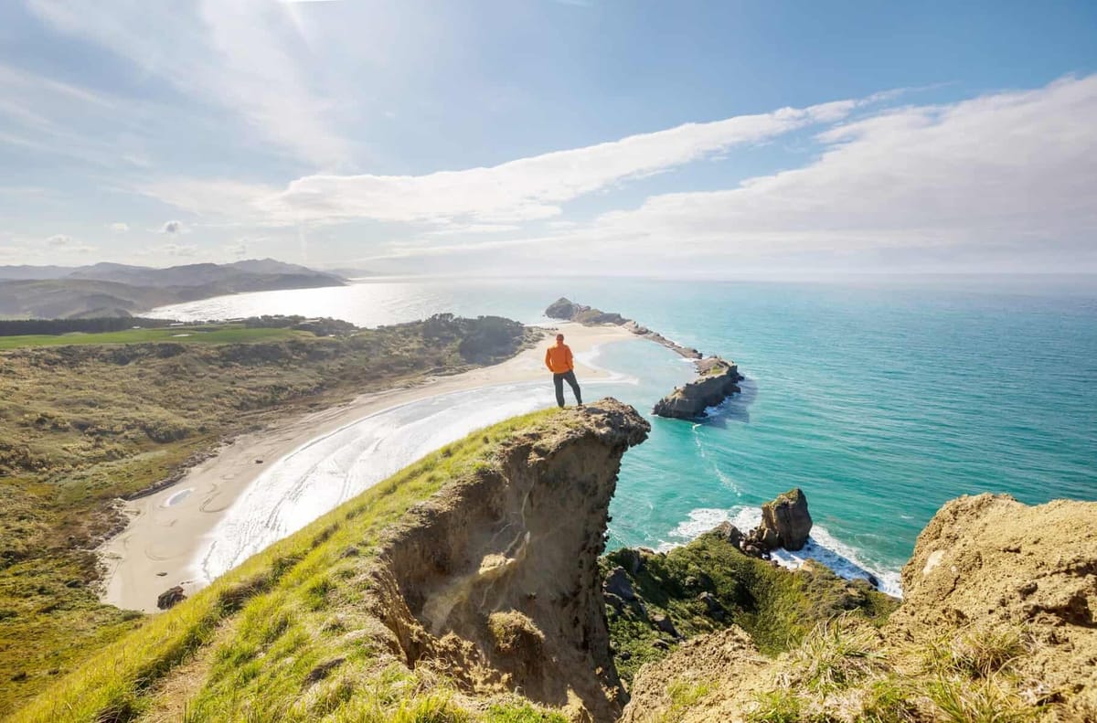 A quiet New Zealand coastal landscape at golden hour